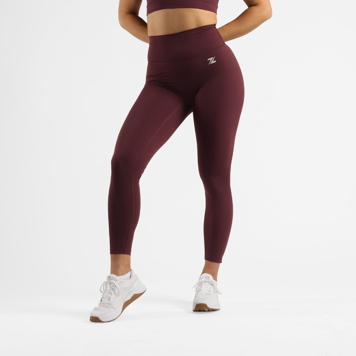 ZEUZ Sportlegging lang bordeauxrood – voorkant met hoge tailleband en strakke pasvorm